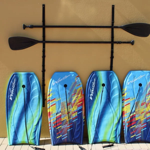 boogie boards and SUP paddles leaning against the wall at beautiful oceanfront Plaza Resort & Spa in Daytona Beach Florida