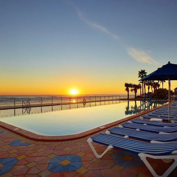 beachfront pool sunrise at beautiful oceanfront Plaza Resort & Spa in Daytona Beach Florida