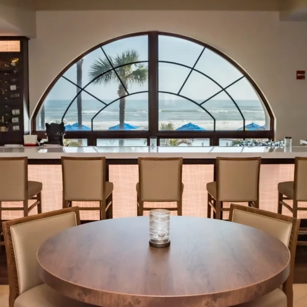 indoor restuarant and bar overlooking the beach at beautiful oceanfront Plaza Resort & Spa in Daytona Beach Florida