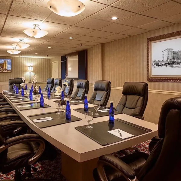 meeting boardroom with a tv screen, executive table and chairs at beautiful oceanfront Plaza Resort & Spa in Daytona Beach Florida