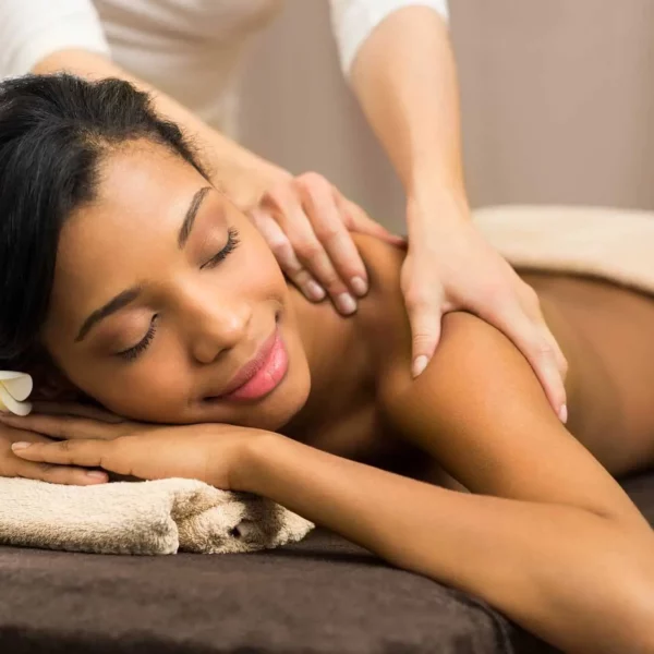 young black woman relaxing while getting a massage at beautiful oceanfront Plaza Resort & Spa in Daytona Beach Florida