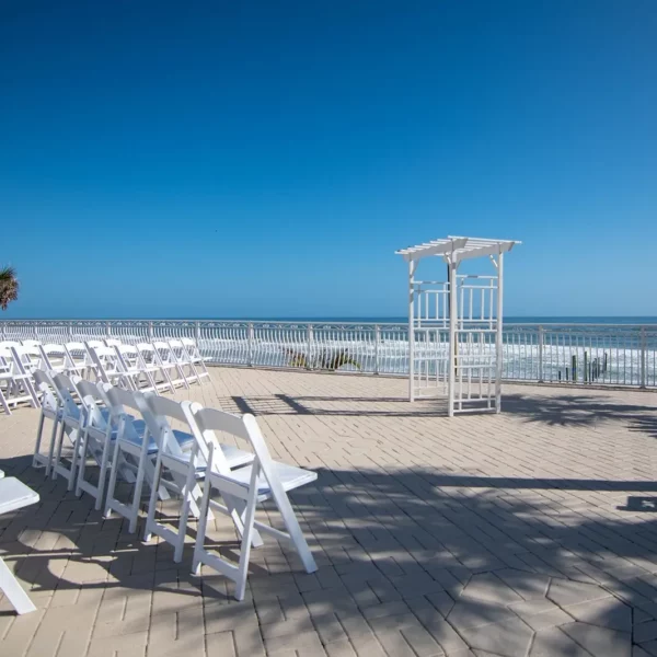 beachfront alter and wedding ceremony seating on the patio at beautiful oceanfront Plaza Resort & Spa in Daytona Beach Florida